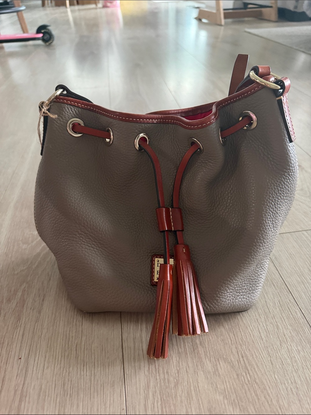 Dooney & Bourke Taupe Pebble Leather Drawstring Bag with Brown Trim
